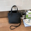 Stylish black pebble leather bucket bag with top handles and adjustable shoulder strap - Black without Pendant