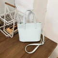 Fashionable mint green leather tote bag with top handle and adjustable shoulder strap - Blue Without Charm