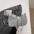Close-up of hobo bag with silver buckle and pearl lace heart pendant accessory - Gray Blue With Pendant