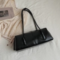 Elegant black glossy rectangular shoulder bag with decorative stitching on white texture - Black