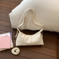 Detail of white lychee leather hobo bag with pleated stitching and dual straps - White