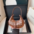 Brown semi-circle hobo bag with silver rivet accents and double zipper design - Brown