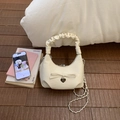 Milk white half-moon crossbody bag with bow detail and metallic heart pendant - White