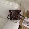 Detail of dark brown quilted leather bucket bag with gold chain and leather strap - Coffee without Pendant