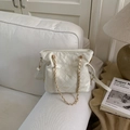 Close-up of white quilted bucket bag with gold chain strap and drawstring closure - White Without Pendant