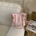 Detailed close-up of light pink quilted handbag featuring elegant gold chain strap texture - Pink Without Pendant