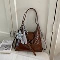Detail of brown vintage PU leather shoulder bag with floral charms and silk scarf - Brown with Pendant