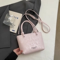 Borsa a secchiello rosa chiaro in pelle lucida con manico e tracolla sottile - Senza Ciondolo / Rosa