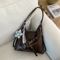 Detailed view of dark brown glossy leather tote bag with silver flower charm and silk scarf - Coffee with Pendant