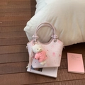 Chic pink cross-body bucket bag with cute cartoon prints and a white teddy bear charm - Pink With Pendant
