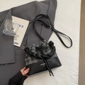 Grey checkered drawstring bucket bag with black leather base and woven handle detail - Black