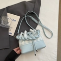 Vintage light blue and white checkered bucket bag with a woven handle and long strap - Blue