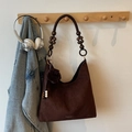 Dark brown suede hobo bag with wooden bead shoulder strap and plush ball charm accessory - With Charm / Coffee