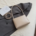 Minimalist creamy beige soft leather bucket bag with an adjustable shoulder strap - Khaki (No Pendant)