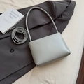 Minimalist soft leather bucket bag in light greyish-green with adjustable shoulder strap - Blue Without Charm