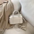Detail of white leather Boston bag with embossed brand lettering and silver metal zippers - White (No Pendant)
