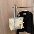 Minimalist cream tote bag with blue graffiti print and plush bunny charm on hanger - Blue with Pendant