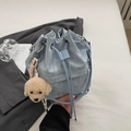 Light blue drawstring bucket bag with a cute plush puppy pendant and wrinkled texture - With Charm / Blue