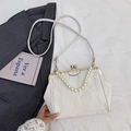 Elegant white satin shell bag with pearl handle, gold metal clasp and long shoulder strap - Off White
