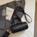 Classic black cylinder pillow bag with silver hardware and adjustable shoulder strap - Black