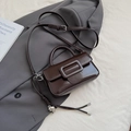 Deep coffee small crossbody bag with glossy leather finish and silver heart charm - Coffee with Pendant