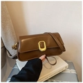 Detail view of brown leather shoulder bag with vintage gold buckle and smooth finish - Brown