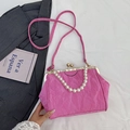 Pink pleated shell bag with large pearl handle and metal clasp in a stylish top view - Rose Red