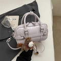 Chic light purple bowling handbag with cute pony charm and adjustable crossbody strap - With Charm / Purple