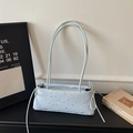 Light blue faux leather handbag with silver star prints and side drawstrings - Blue