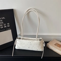 Creamy star-patterned faux leather shoulder bag with drawstring details and slim straps - Off White