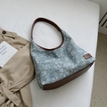 Blue denim floral tote bag with brown leather trim and vintage floral pattern style - Blue