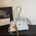 Elegant light blue commuter tote bag for women with gold hardware and plush puppy charm - Blue with Pendant