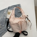 Pink nylon bucket bag detail with exterior pockets and decorative zebra charm - Pink (With Pendant)