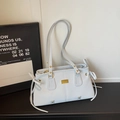 Chic light blue commuter tote bag with side bow detail and golden hardware accents - Blue Without Charm