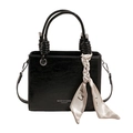 Minimalist black glossy handbag with a textured finish and decorative silk scarf detail - Black without Pendant