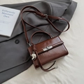 Deep brown glossy leather handbag with silver lock and heart charm in variant color - Brown with Heart Charm