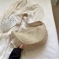 Stylish beige straw woven half-moon crossbody bag with adjustable wide fabric shoulder strap - Off White