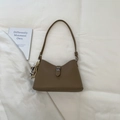 Brown lychee leather bucket bag with silver heart pendant and metal clasp closure - Khaki With Pendant