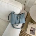 Morandi light blue bucket bag with lychee grain leather and silver turn-lock closure - Blue Without Charm