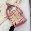 Pink striped canvas bucket bag with colorful woven pattern and leather handle - Pink
