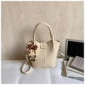 Creamy white leather bucket bag with top handle and cute teddy bear charm detail - Off-White with Pendant