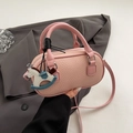 Pink lychee grain leather mini bowling bag with cute horse charm and shoulder strap - With Charm / Pink