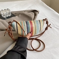 Colorful striped straw crescent bag with brown knotted shoulder strap in casual setting - Brown