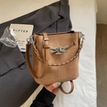 Bolso tipo cubo vintage marrón con hebilla de lazo plateada y asa trenzada mujer - Caqui