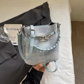 Light blue denim texture bucket bag with woven handle and silver metal twist lock - Blue