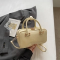Minimalist cream white Boston handbag with gold hardware and Rosy Dodenia logo detail - Yellow