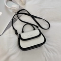 Chic black and white square crossbody bag with leather texture and silver hardware - Black And Rice White