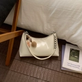 Detail of cream hobo bag with silver bead strap and cute plush bear keychain accessories - With Pendant / White