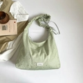 Light green canvas hobo bag with silver stars and stylish ruffled shoulder strap - Green