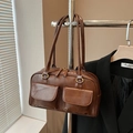 Vintage brown PU leather handbag with dual front pockets and gold-toned metal accents - Two-tone Brown